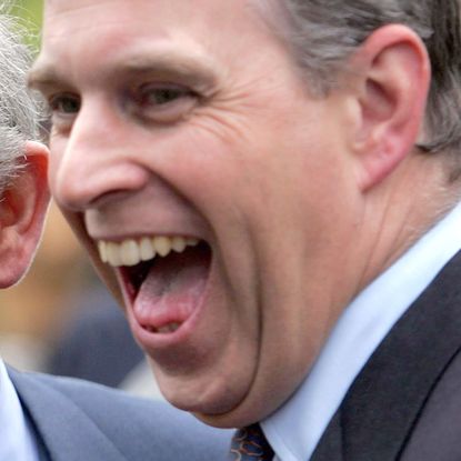 King Charles and Prince Andrew both laugh while wearing suits