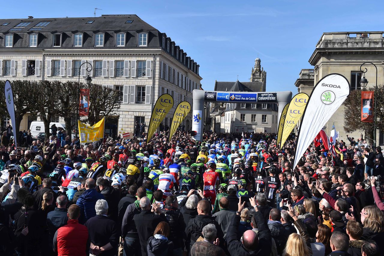 The riders await the start under the arch in Compiegne