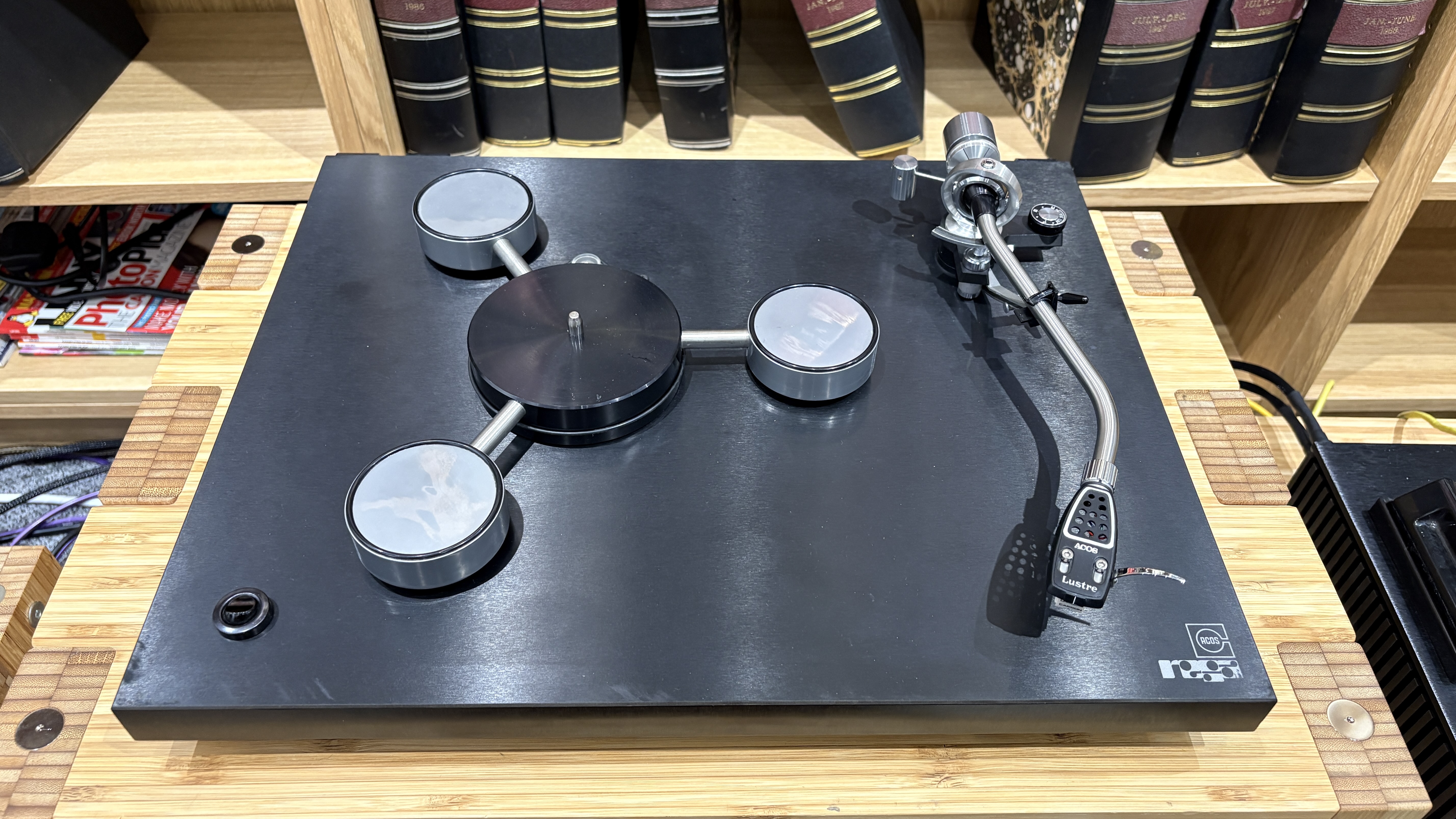 Original Rega Planet turntable with Acos Lustre tonearm on wooden hi-fi rack