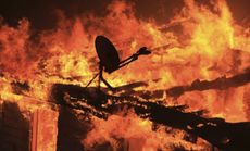 A house burns near Banning, Calif., on August 7.