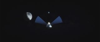 A simulated view of the SpaceX Interplanetary Transport System traveling to Mars, using solar panels to gather energy.