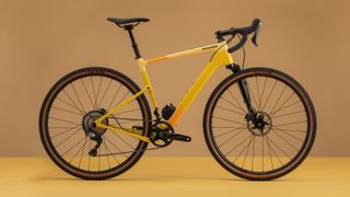 Cannondale Topstone Carbon Gravel Bike 2022 painted yellow against a yellow studio background