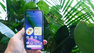 Google Pixel 10 showing home screen and widgets in dark blue