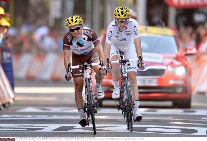 Romain Bardet is led to the finish by his teammate Samuel Dumoulin