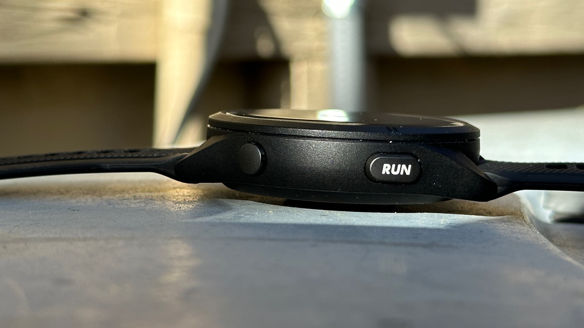Side view of the Garmin Forerunner 265, showing the new wider 