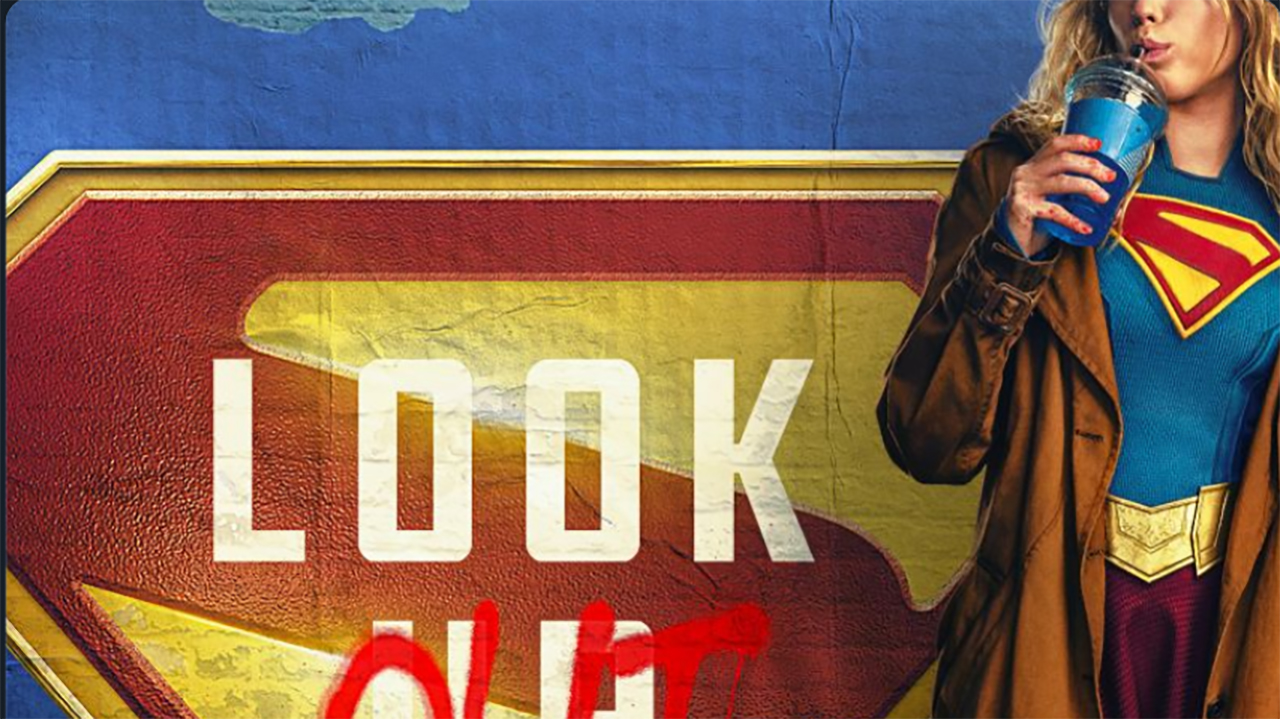 A screenshot of part of the first poster for Supergirl showing the DCU hero sipping on a drink next to a graffitied Superman logo