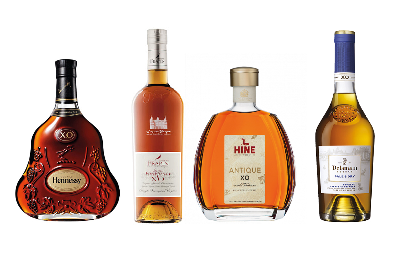 Four XO Cognac bottles: Hennessy, Frapin, Hine, Delamain