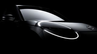 Tease shot of the hood of the compact Nissan EV