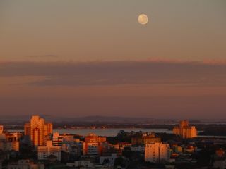 The supermoon full moon of July rises over Porto Alegre, Brazil. This photo was taken by Carlos Guilherme Allgayer in the early morning of July 13, just after the moon was at its peak.