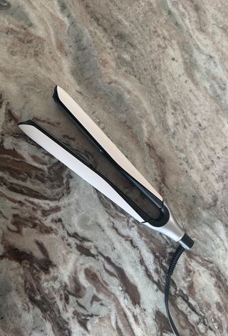 GHD chronos hair straightener on marble surface