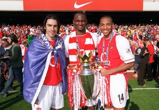 Arsenal trio Thierry Henry, Patrick Vieira and Robert Pires celebrate with the Premier League trophy in 2004.