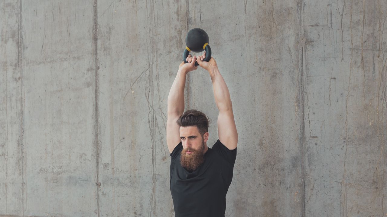 Man doing kettlebell swing