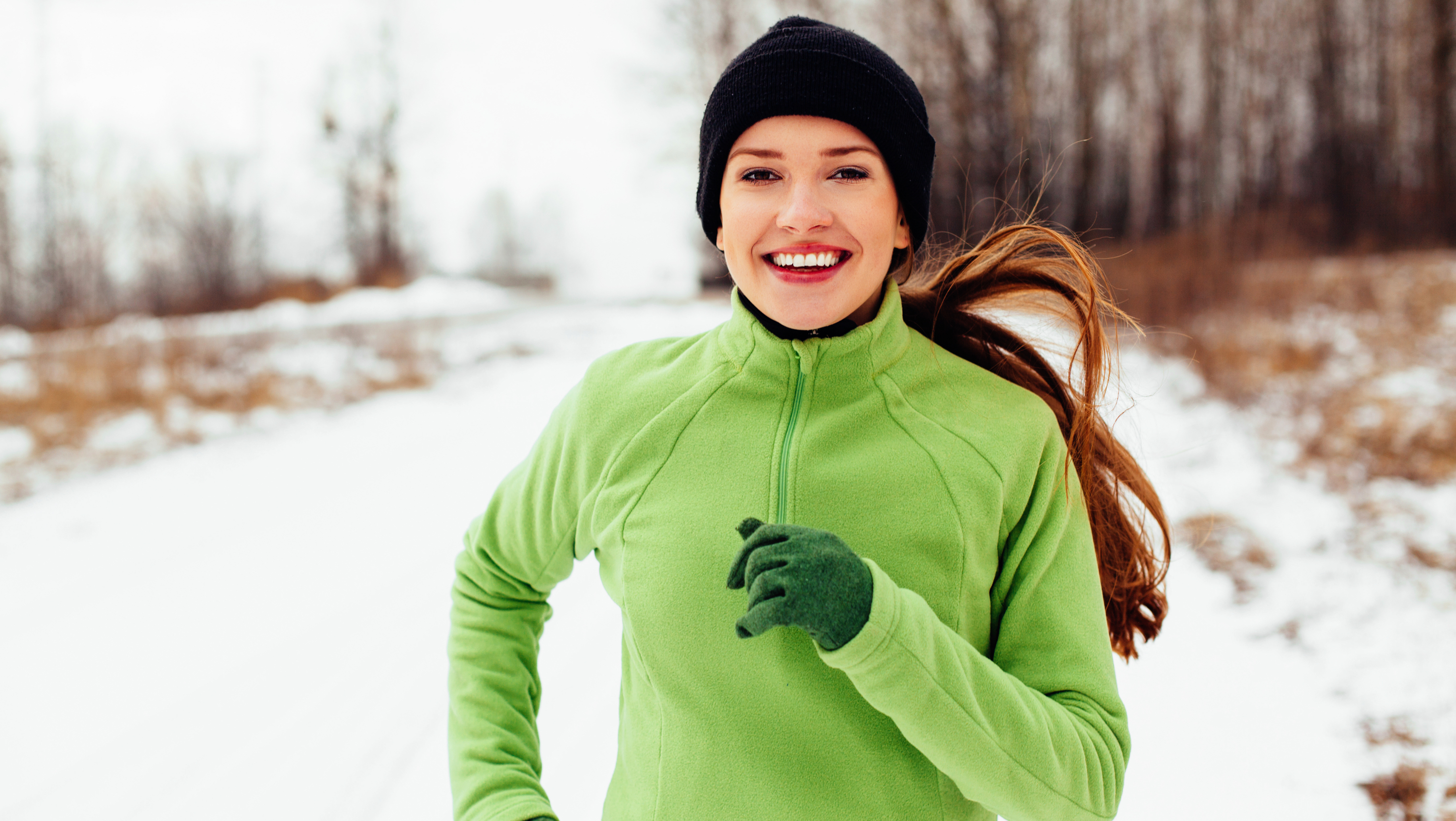 a woman running in the cold