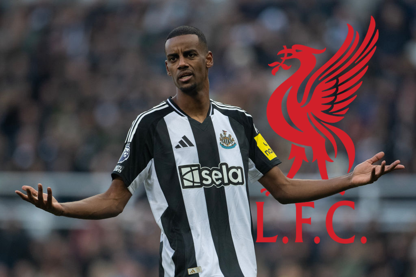 Alexander Isak Newcastle United striker with his arms outstretched in the Premier League as a Liverpool crest is behind him