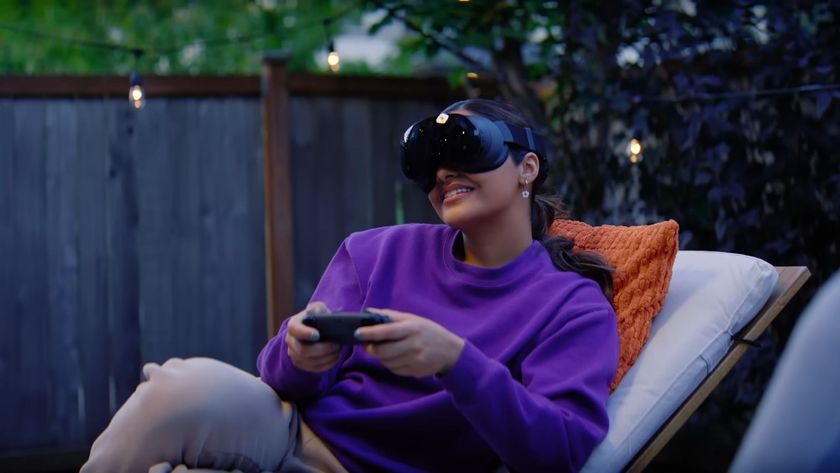A woman playing a game with a controller using the Steam Frame 