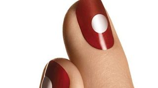 red and white nailpolish on nails