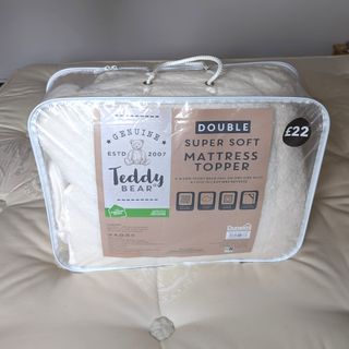 The Dunelm Teddy Mattress Topper being tested in a bedroom