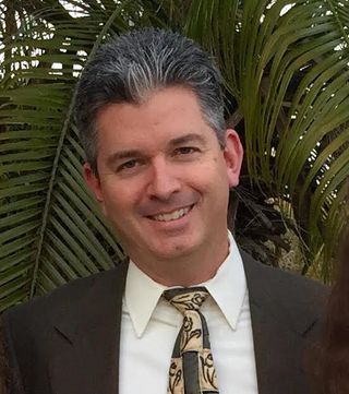Smiling headshot of Derek Badala Director of Sales - The Americas, Synthax.