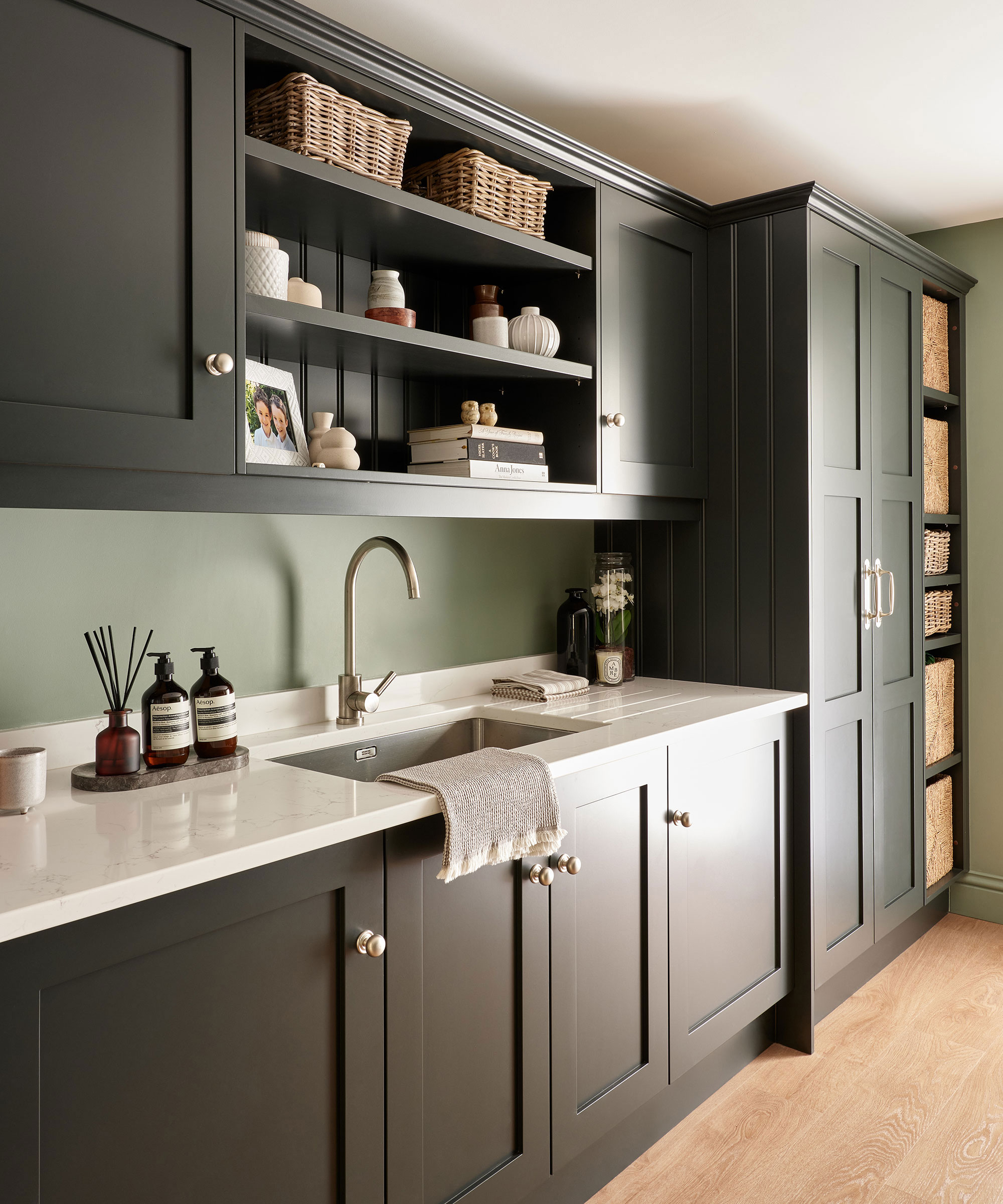 black Shaker utility room with white composite worktops and open shelving