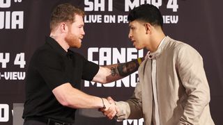 Canelo (L) and Munguia (R) shake hands ahead of their fight