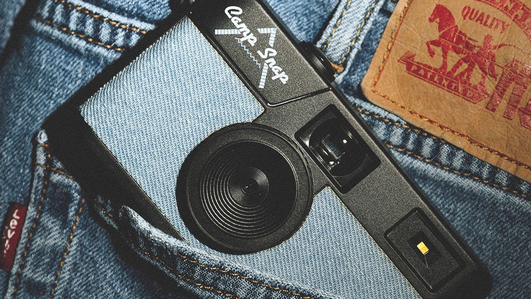 The Camp Snap camera with a denim blue wrap