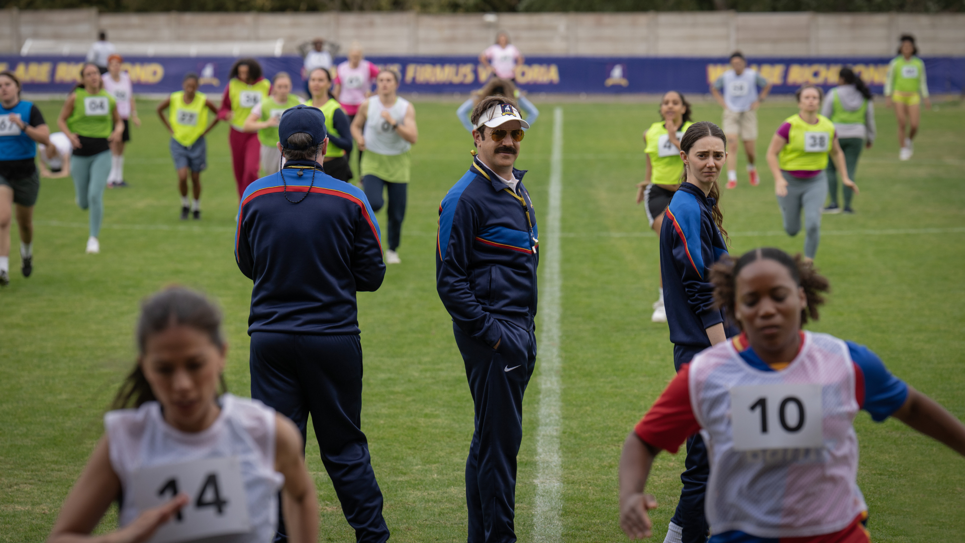 Jason Sudeikis as Ted Lasso and Tanya Reynolds in Ted Lasso season 4