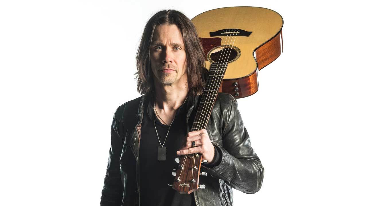 Alter Bridge’s Myles Kennedy with a guitar over his shoulder