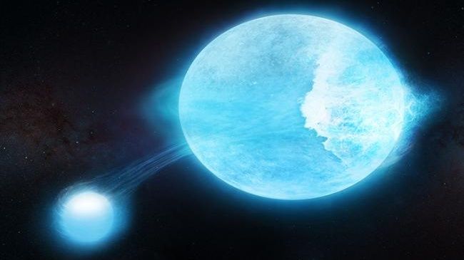 An artist&#039;s illustration of two glowing blue stars against the dark background of space, one smaller and one larger. They appear to be connected by a wispy trail of stellar material arising from the larger one.