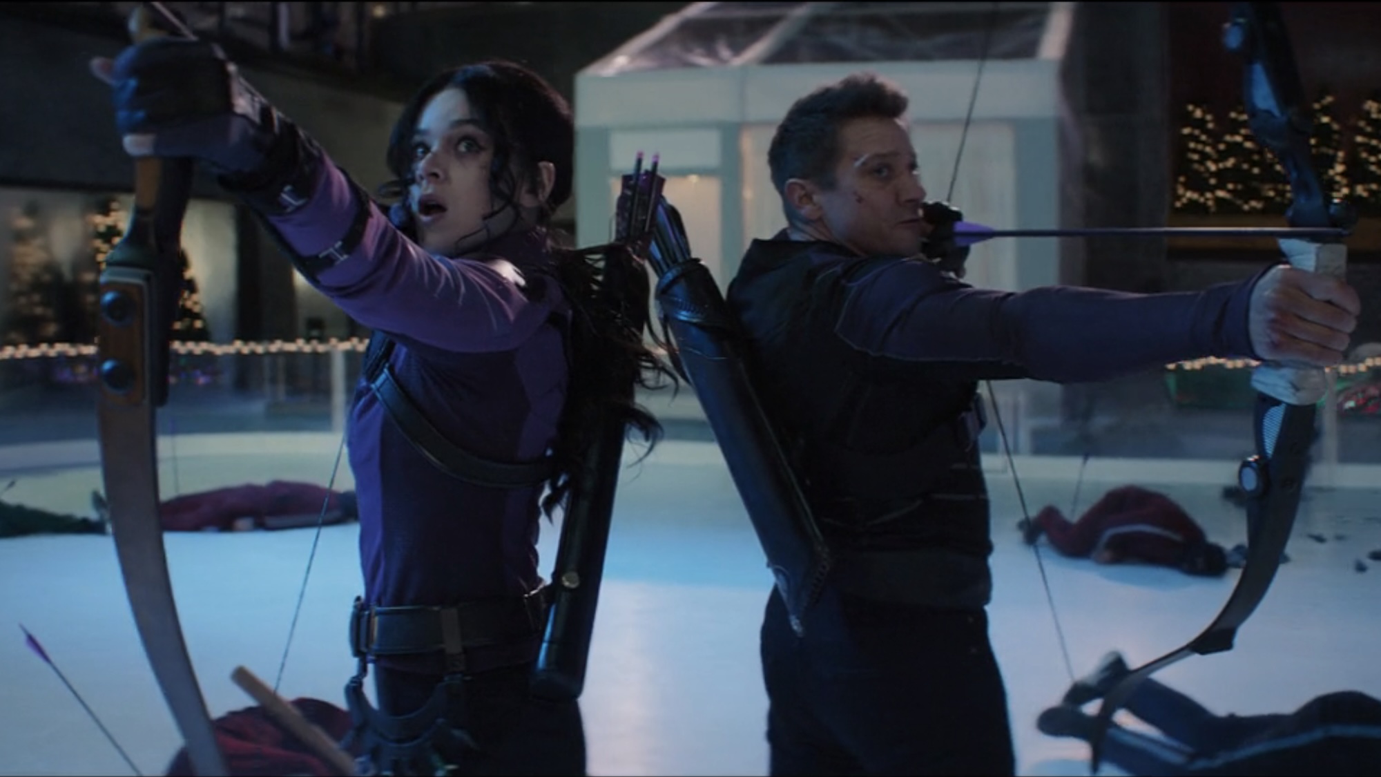 Kate Bishop and Clint Barton with their bows out on the ice in the final battle of Hawkeye. 