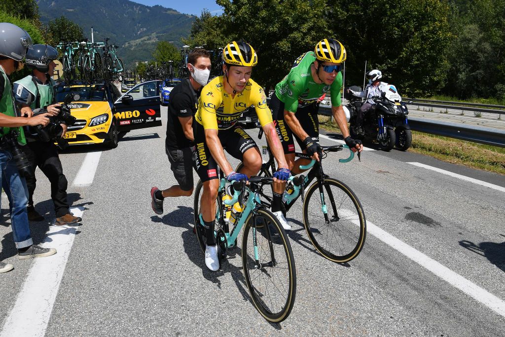 Primoz Roglic sets off again after his crash