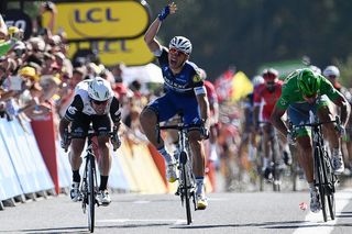 Marcel KIttel (Etixx-QuickStep) throws up his arms in complaint of Mark Cavendish's sprint
