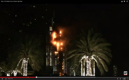 A building is seen on fire in Dubai before New Year festivities.