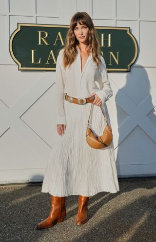 Fashion week boho street style outfit with light brown leather knee boots