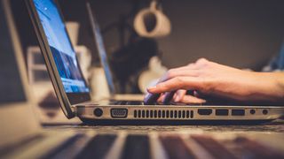 person typing on laptop at desk