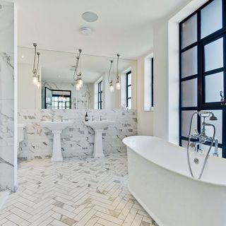 Bathroom with twin sinks and double shower