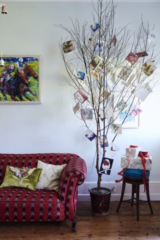 red sofa and twig Christmas tree