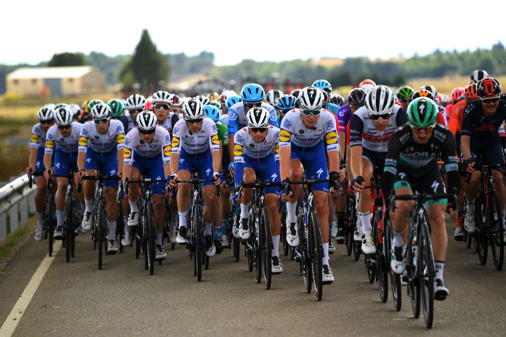 EJEADELOSCABALLEROS SPAIN OCTOBER 23 Sam Bennett of Ireland Andrea Bagioli of Italy Mattia Cattaneo of Italy Ian Garrison of The United States Michael Morkov of Denmark Jannik Steimle of Germany Zdenek Stybar of Czech Republic and Remi Cavagna of France and Team Deceuninck QuickStep Alexander Kamp Egested of Denmark and Team Trek Segafredo Dylan Van Baarle of The Netherlands and Team INEOS Grenadiers Peloton during the 75th Tour of Spain 2020 Stage 4 a 1917km stage from Garray Numancia to Ejea de los Caballeros lavuelta LaVuelta20 La Vuelta on October 23 2020 in Ejea de los Caballeros Spain Photo by David RamosGetty Images