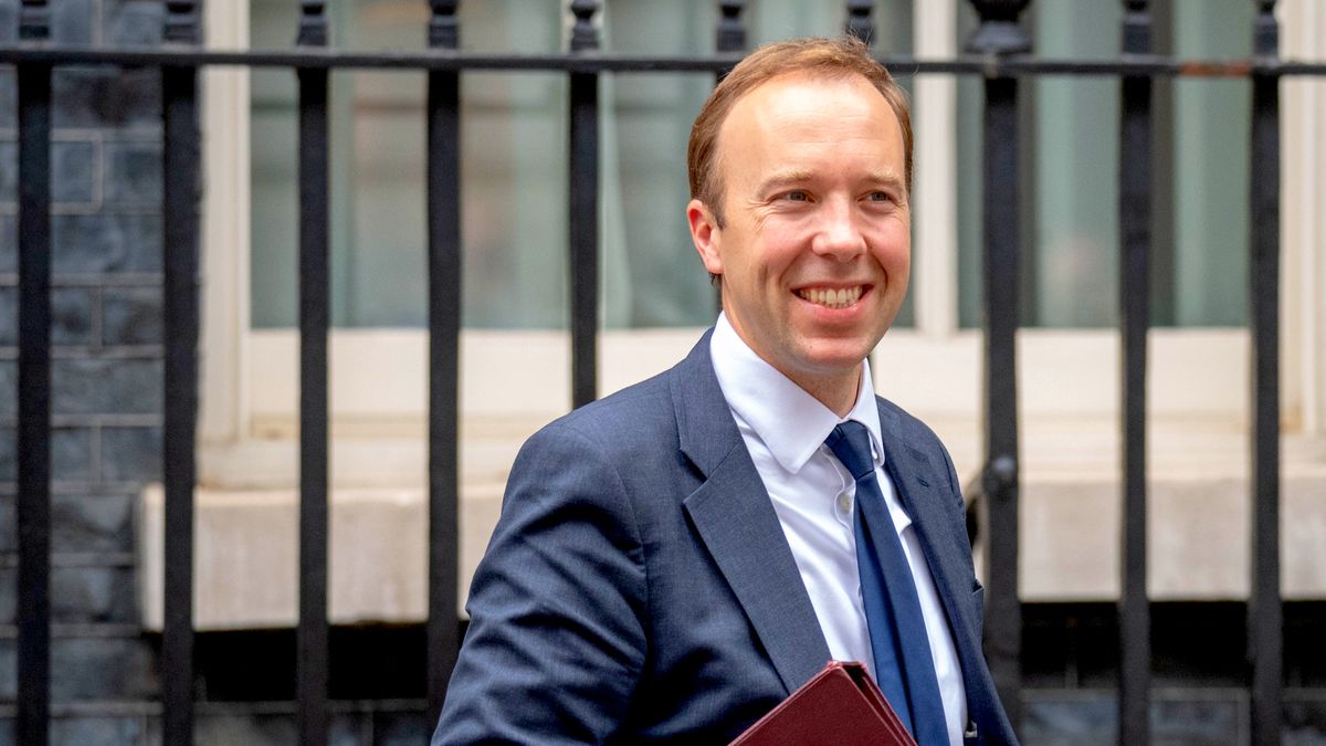 Health Secretary Matt Hancock smiling while walking