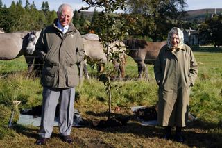 The Queen and Prince Charles plant a copper beech tree on the Balmoral Estate