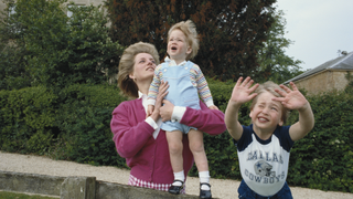 Princes William and Harry with their mother, Diana, Princess of Wales (1961 - 1997) in the garden of Highgrove House in Gloucestershire, 18th July 1986