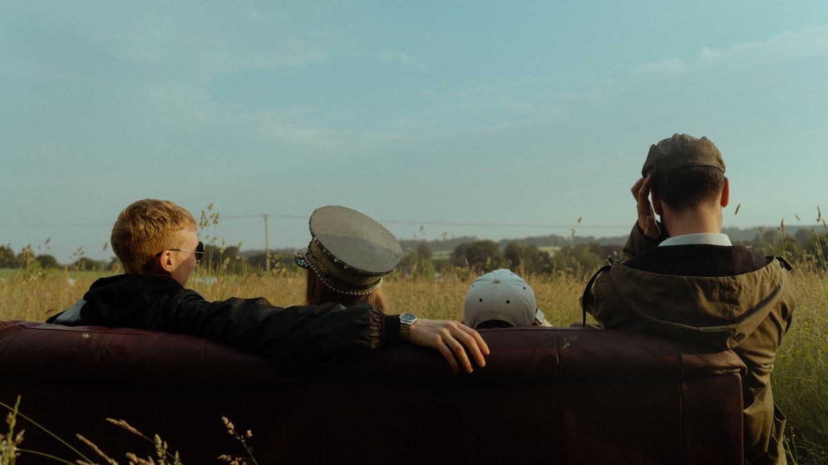 Candid photography 4 people looking out at a field