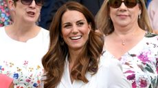 Catherine, Princess of Wales smiles as she attends day 2 of the Wimbledon Tennis Championships in 2019