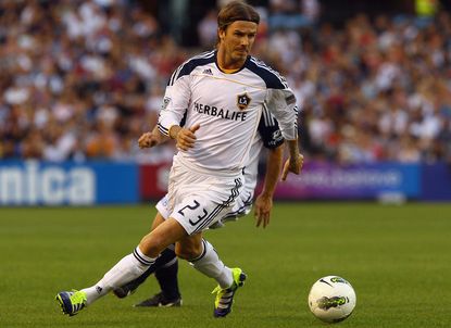 David Beckham is considering playing professional soccer again