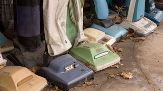 A collection of old vacuum cleaners