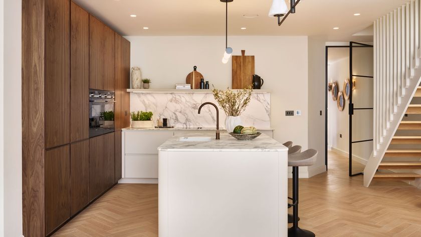 classic kitchen with white kitchen island and walnut full height cabinets