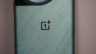 The OnePlus 12 on a grey background