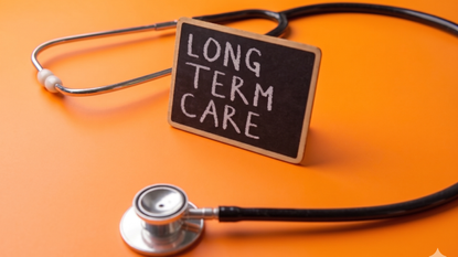 Picture of a stethescope and a small sign saying "LONG TERM CARE" on an orange background.