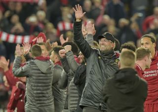 Jurgen Klopp celebrates with players and fans after Liverpool's 4-0 win over Barcelona in the Champions League semi-finals in May 2019.