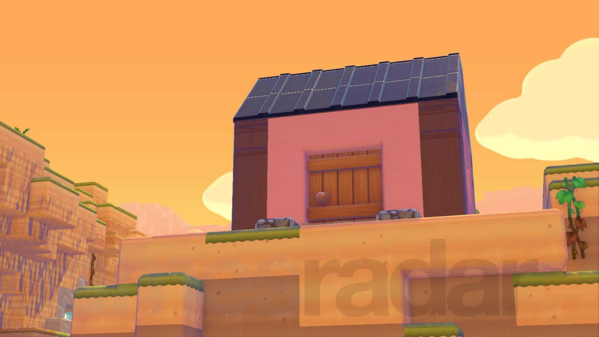 A pink house stands on a cliff in Pokopia, helping to raise the surrounding environment level.