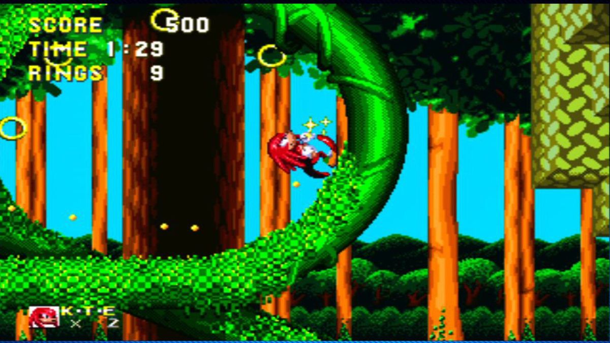 Sonic and Knuckles on the Sega Genesis shows Knuckles running along a looping vine towards some gold rings